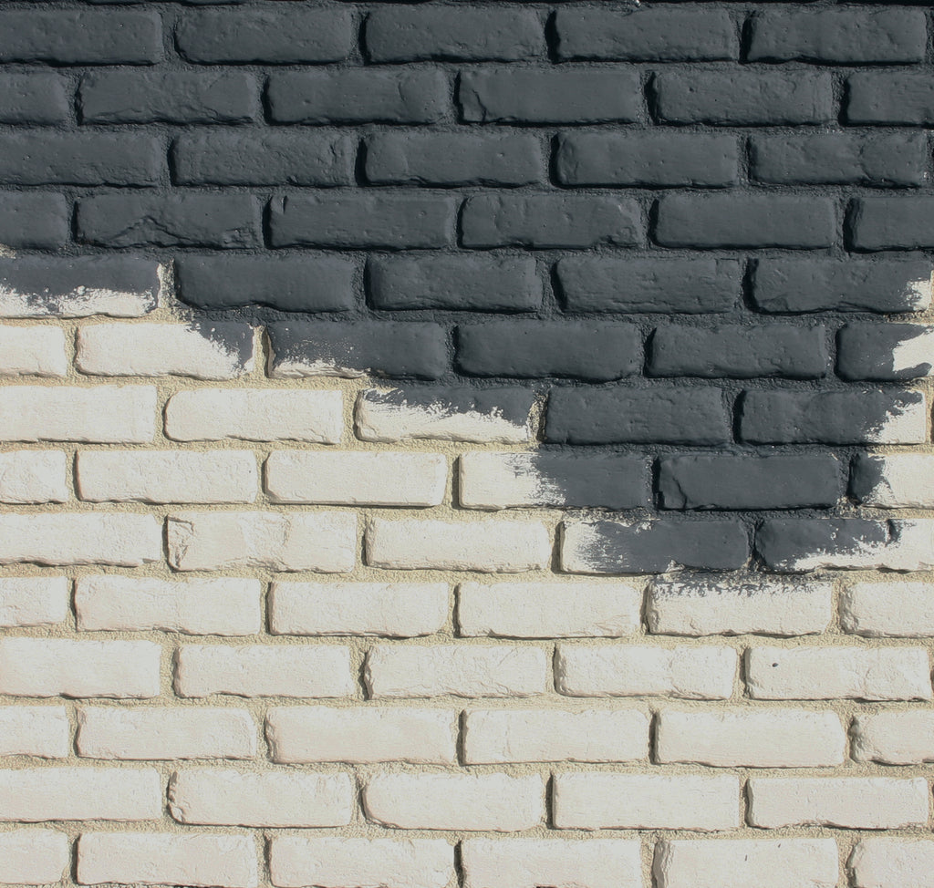 Brick wall detail featuring Creative Mine's Brewery Paintgrade brick being painted a charcoal black color